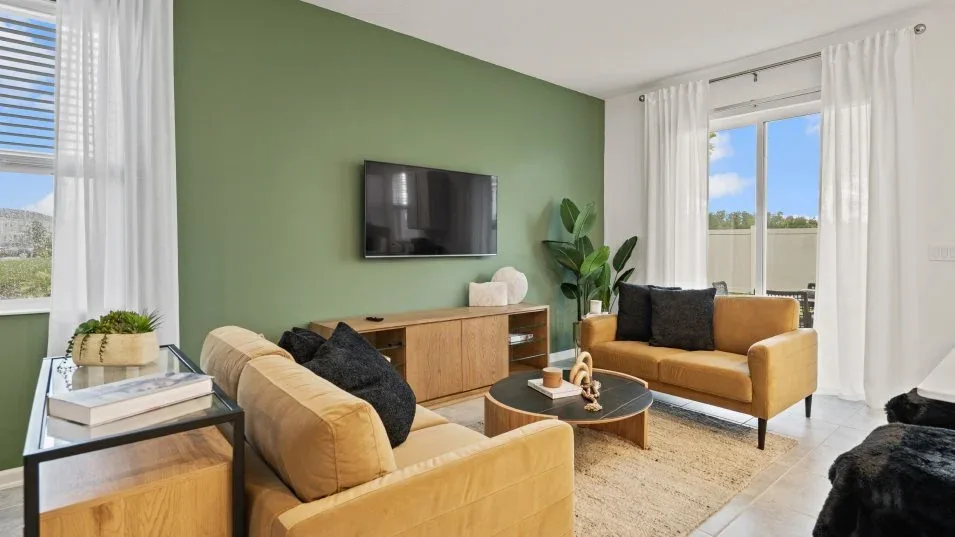 Sala de estar do modelo Sienna no Wellness Ridge Clermont FL, casa Lennar em Orlando para brasileiros